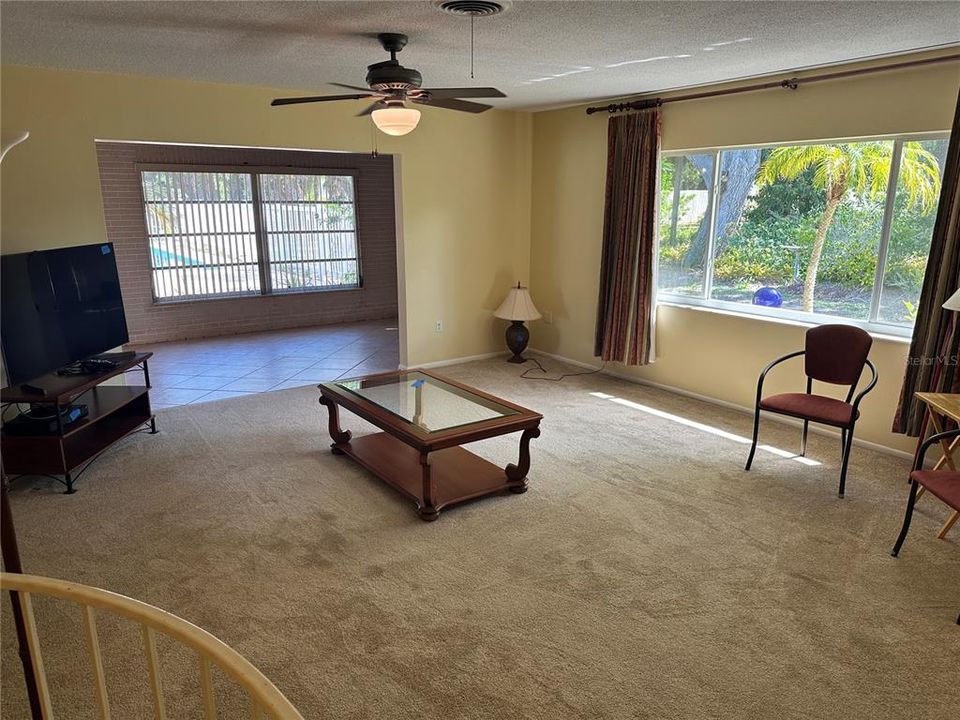 Large great room with picture window. Connect to Florida room along back.
