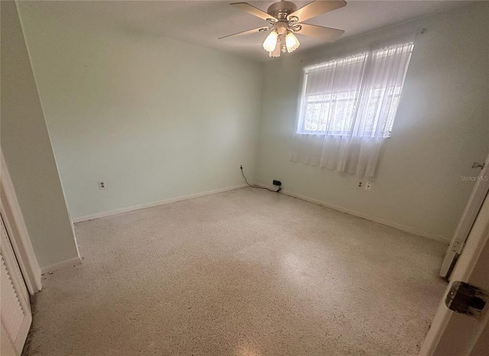 Bedroom 1 - large closet and window.