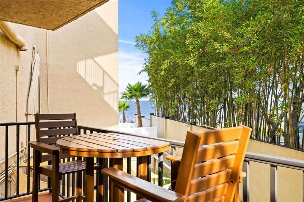 Private balcony with water views and Pollywood Patio furniture (included). Perfect for enjoying a morning cup of coffee or catching the sunset.