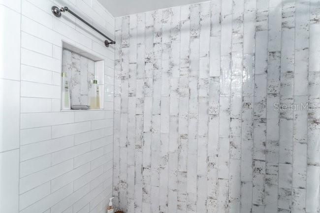and tasteful two tone tile in the tub/shower combo