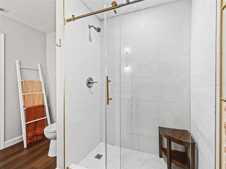 Primary Bath featuring a New Custom Tiled Walk-in Shower with Frameless Glass Shower Doors