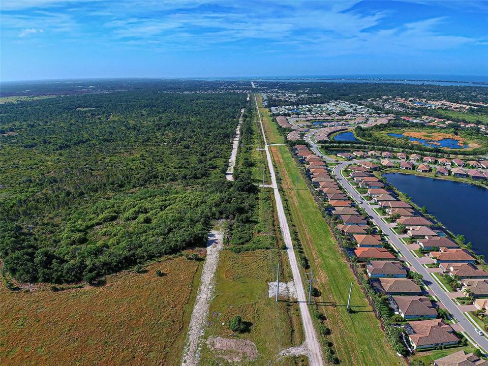 AERIAL VIEW TO THE SOUTH / WEST. INTRACOASTAL WATERWAY, MANASOTA BEACH AND GULF OF MEXICO.