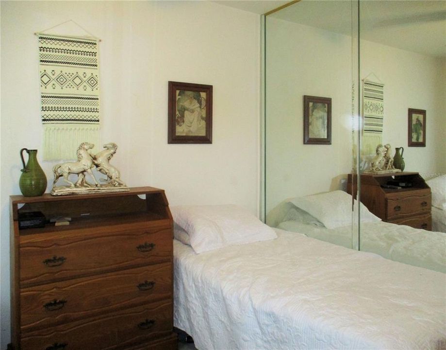 Bedroom 1 looking toward mirrored wall