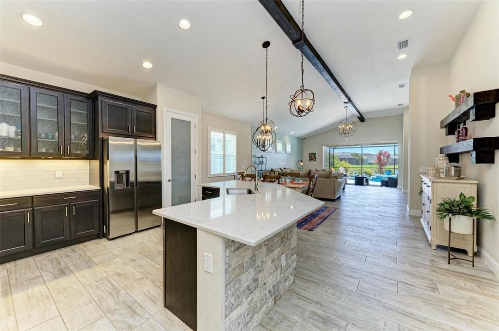 Sweeping view of kitchen, dining, great room.