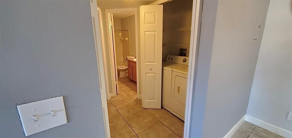 Hallway, laundry, bathroom entrance