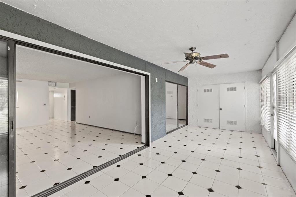 Bonus room/ Florida room with a storage closet and stunning pond and nature views.