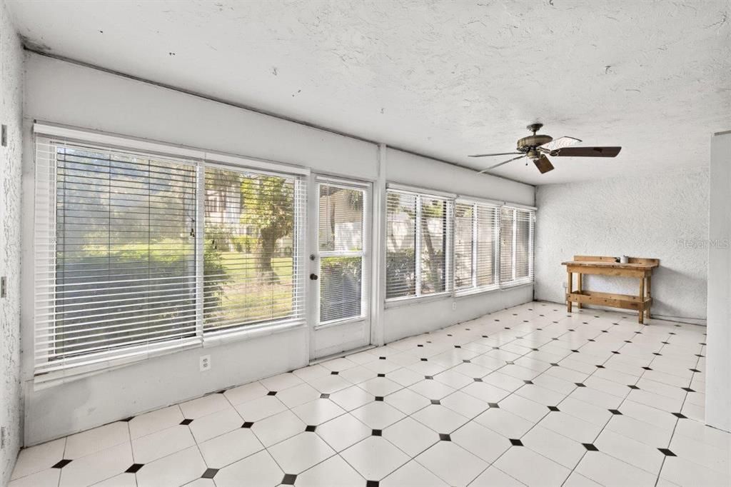 Bonus room/ Florida room with a storage closet and stunning pond and nature views.