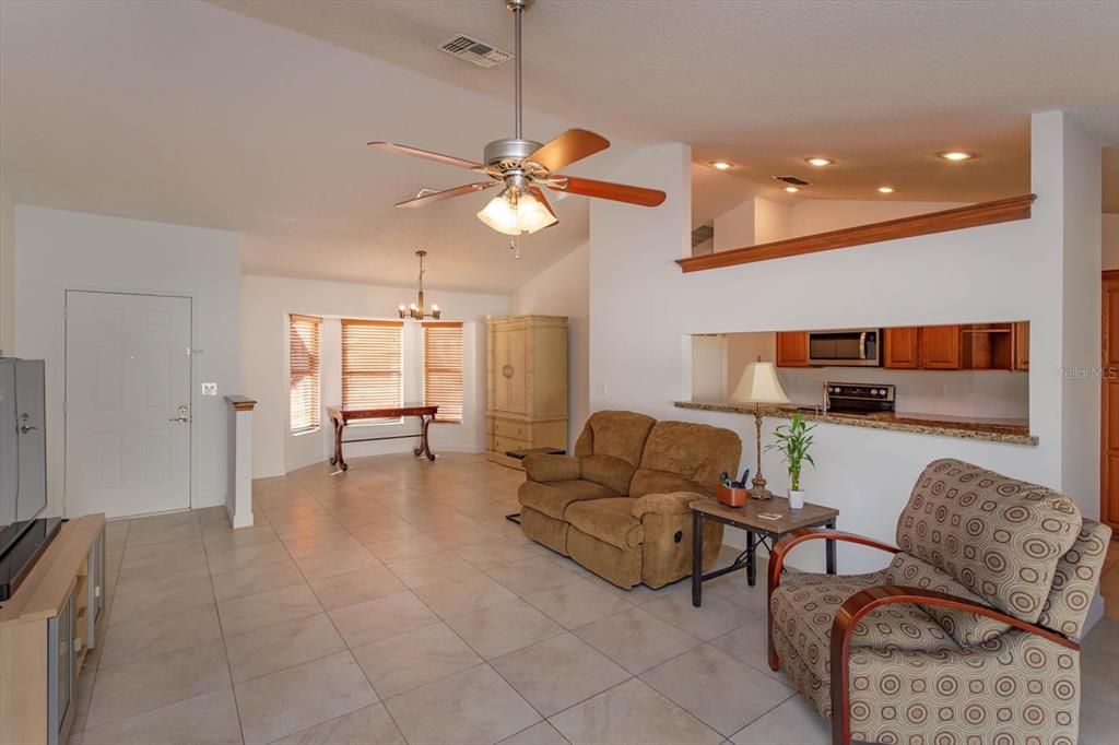 Open concept with expansive ceilings.  The kitchen, dining room and family room are open and inviting.