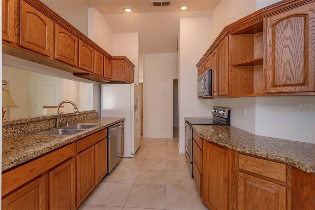 Lots of cabinet and storage space, granite counters, designer faucet, stainless appliances.  A Chefs delight!