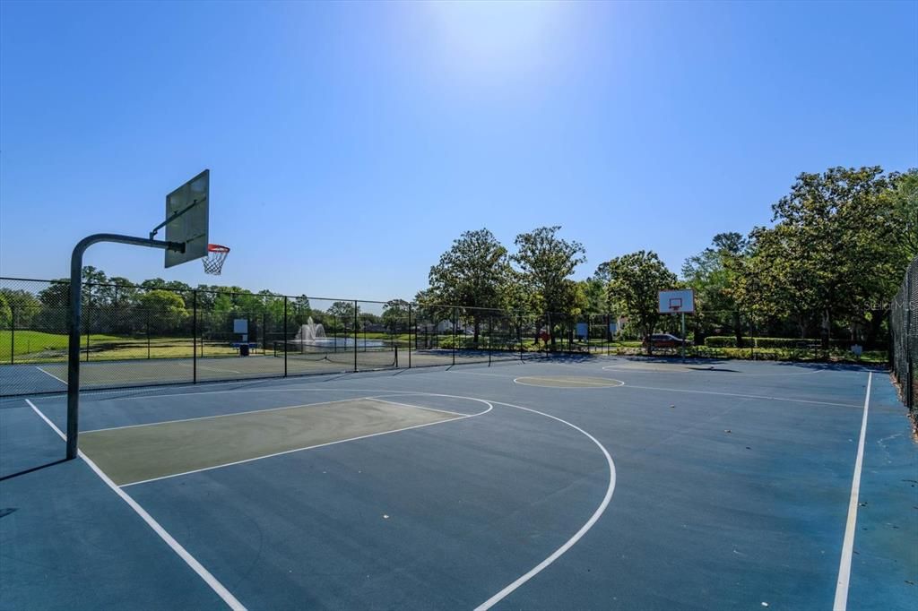 Basketball court located at the community park just steps away from this home.
