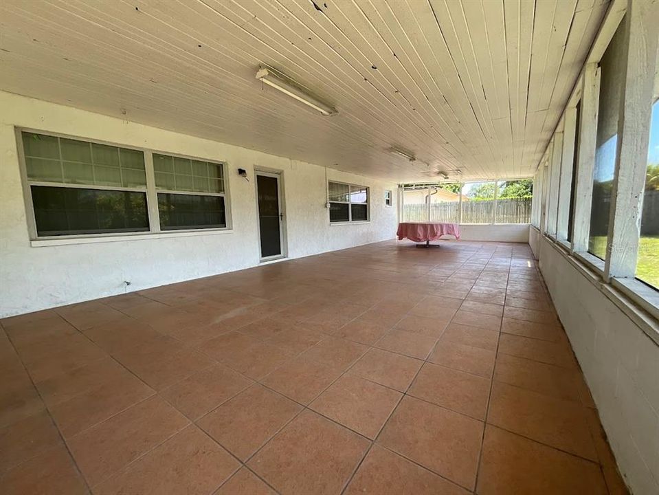 Large covered screened back porch. Great for family gatherings or entertaining.