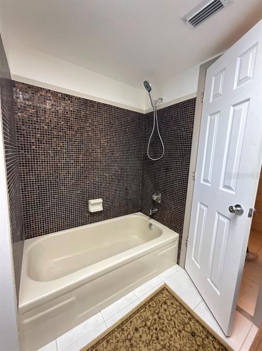 Bathroom #2 has a tub and shower.