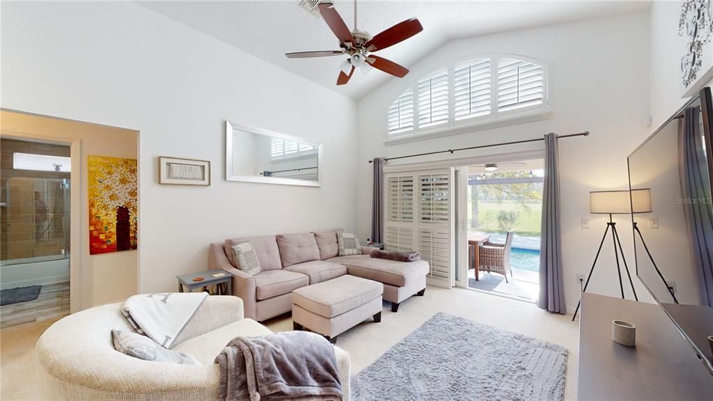 Family room overlooking the pool & open to the kitchen