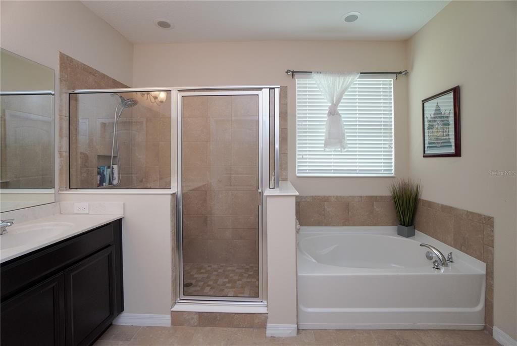 Master bathroom has a separate shower stall.