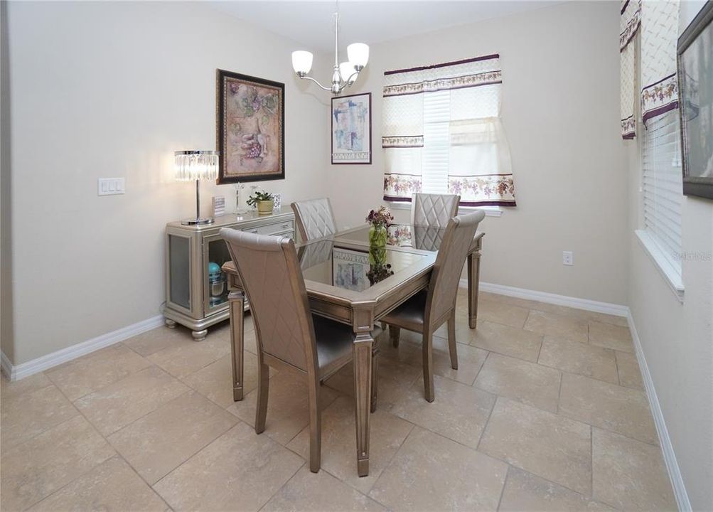 Breakfast nook located right outside of the master bedroom and next to the kitchen is so big that it can serve as the formal dining room.