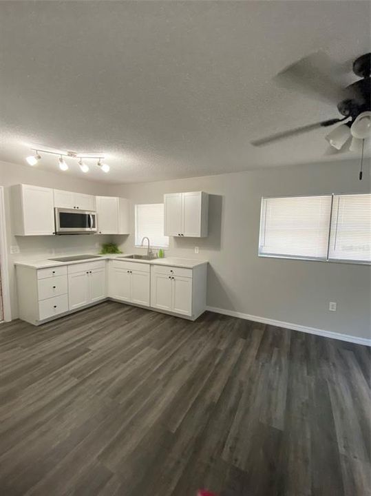 Utility Room has plenty of built in storage to keep you organized and that door right there takes you to covered walk way leading to guest apartment