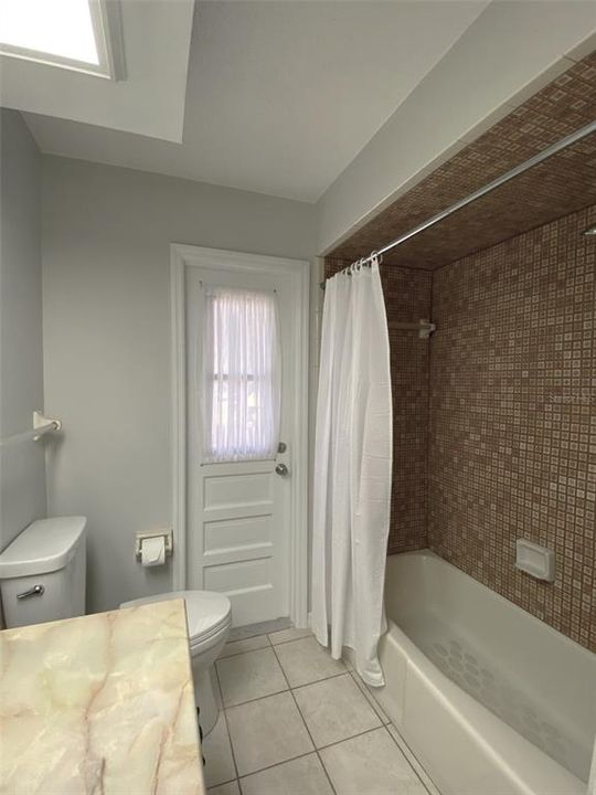 Master bath is large with new vanity and fixtures. Shower and flooring is ceramic tile.