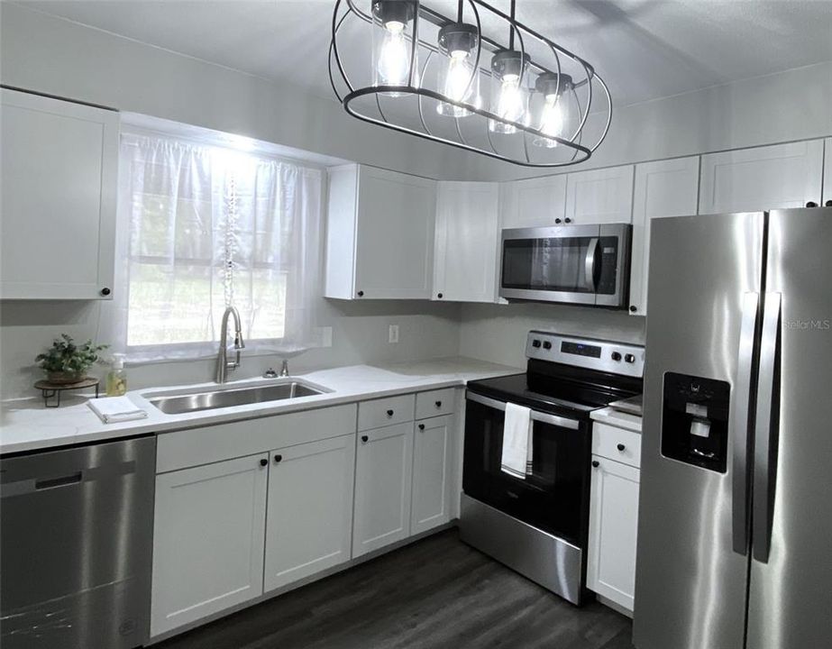 Solid Quartz counter-tops and Breakfast bar