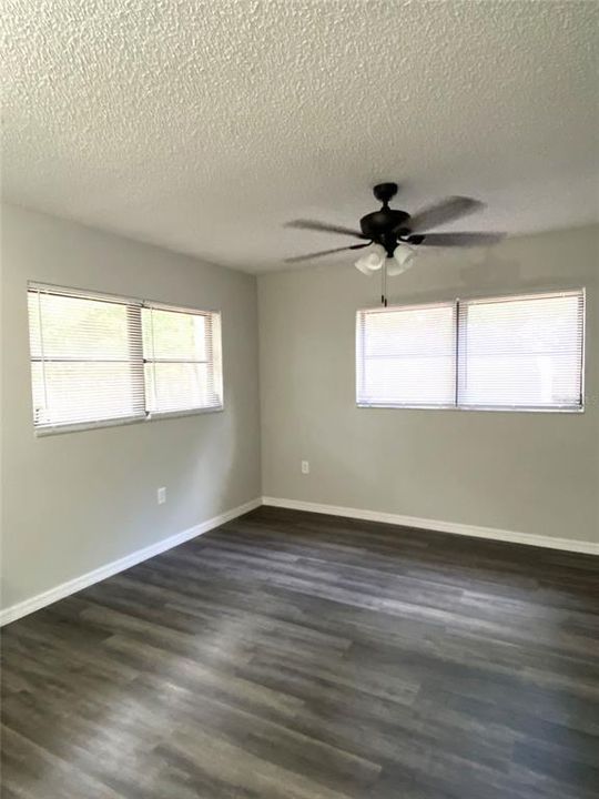 Attractive rustic brick and wood covered Breezeway that runs along side of main house and guest apartment