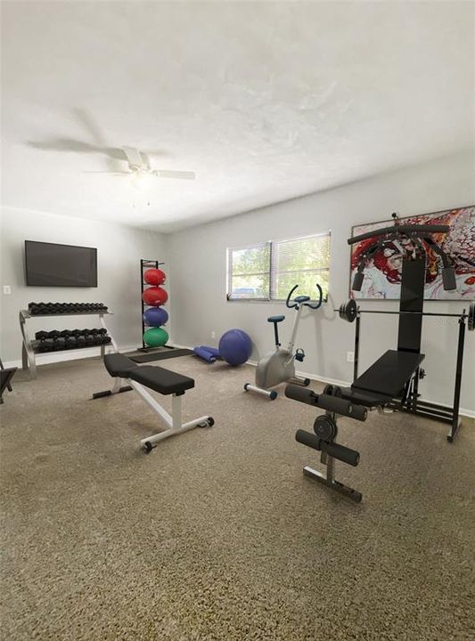 Hall bath is spacious with tile flooring and shower/bath combo