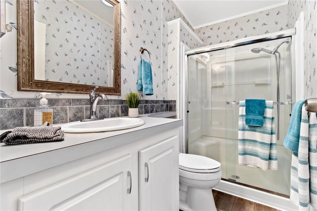A second full bathroom with easy access shower.