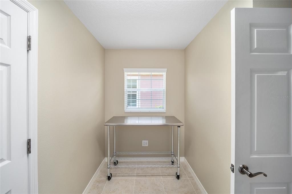 The laundry room has room for a small office, storage...