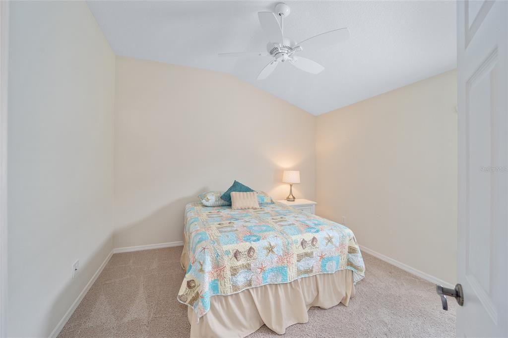 The middle bedroom has a vaulted ceiling.