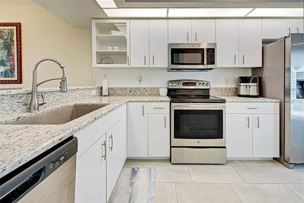 Gourmet kitchen boosts gleaming granite countertops, newer stainless-steel appliances