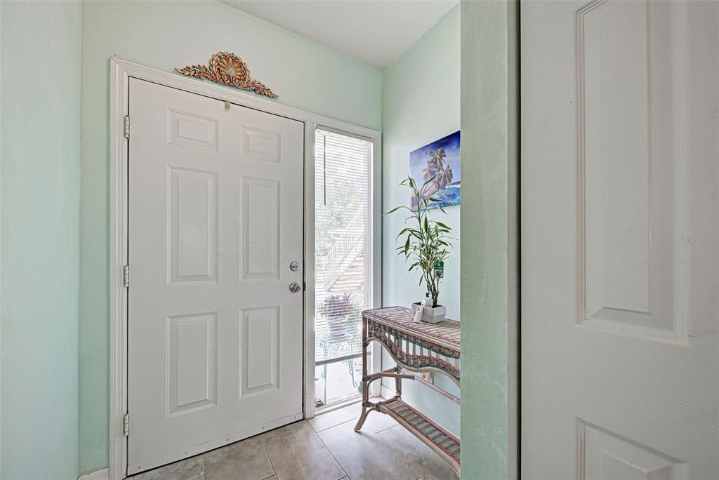 Sunny and gracious entryway greet you to this beautifully renovated and immaculate condo.