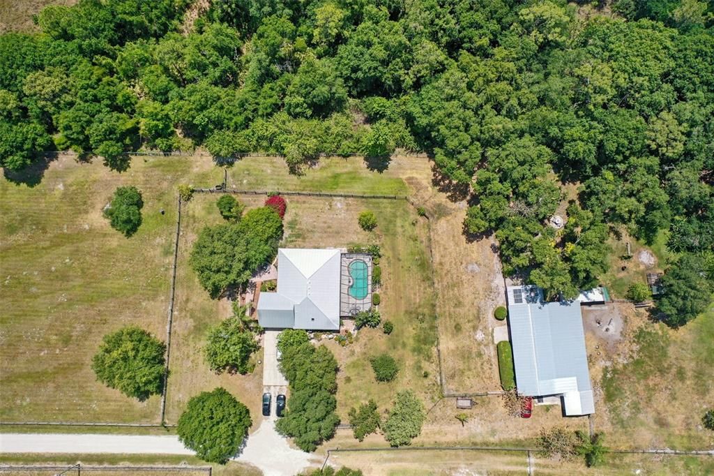 Aerial view of the house and barn.