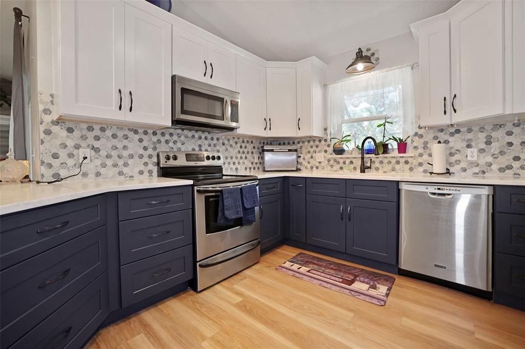 The kitchen has stainless steel appliances and granite countertops.