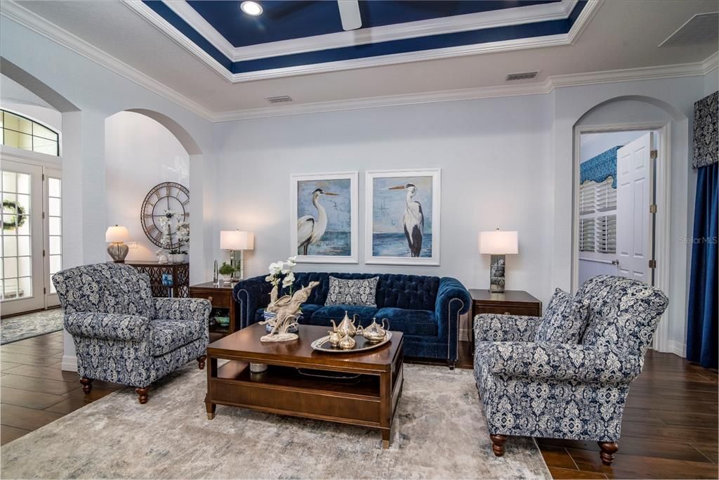 The graceful arches define the living room from the foyer and the dining area. The arch over the doorway to the master suite continues the arch theme.