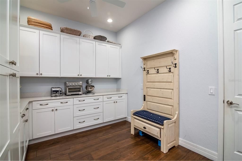 The flex room has lots of cabinets and storage. This space is perfect for a home office or as a crafters lair.
