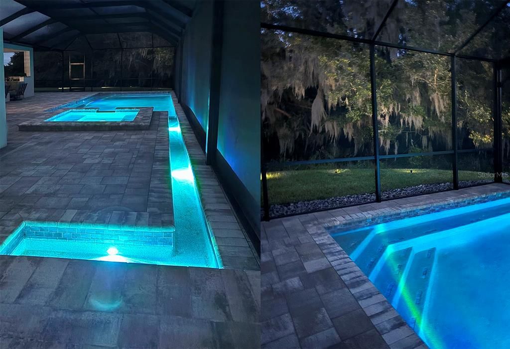 The LED lighting of the pool features from the waterfall to the spa to the pool and the illumination of the tree line amplify the beauty of the pool area.