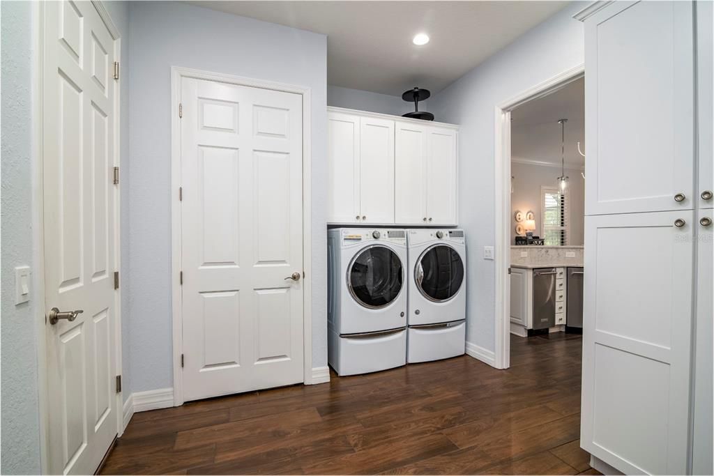 As a "green home" the air handler is behind the door left of the laundry area.