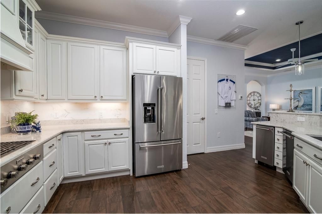 The undercabinet lighting and crown molding adds class to this chef's delight kitchen.