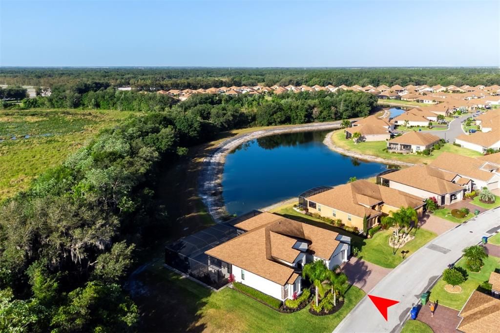 This exceptional home is located on a premium oversized lot with pond, preserve, and woods in the back and golf course and lake out the front.