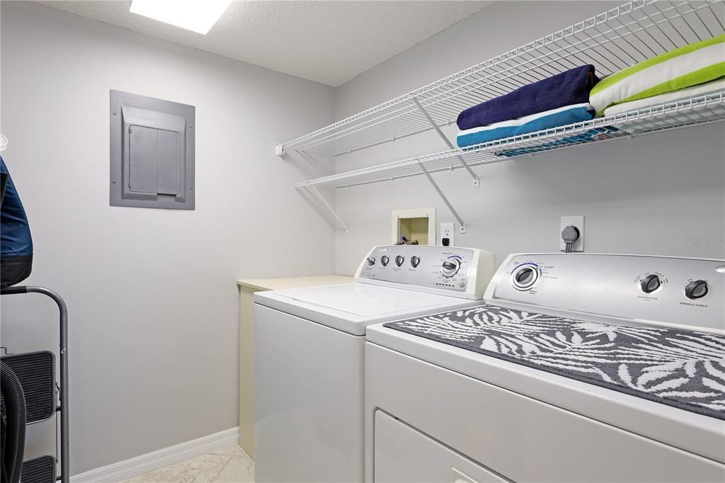 laundry room with full size washer dryer & tons of storage in laundry room inside of unit