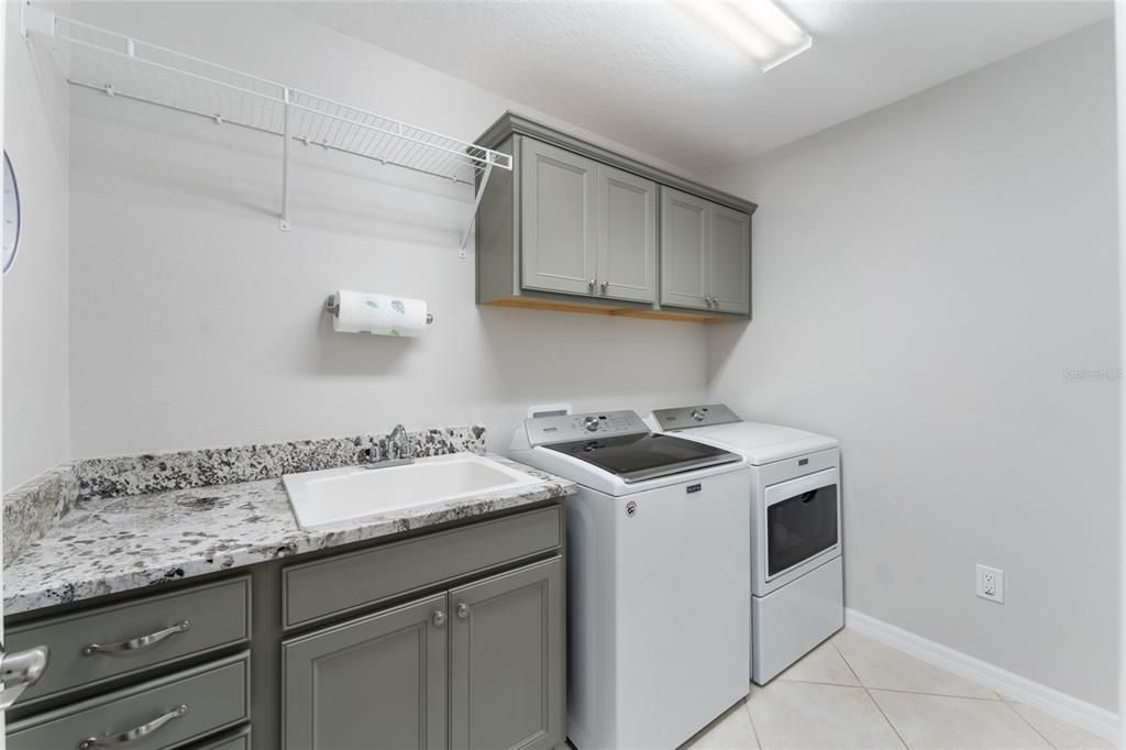 INSIDE LAUNDRY even has matching exotic GRANITE COUNTERTOPS!