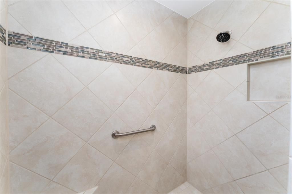 PRIMARY ENSUITE BATHROOM features DIAGONAL SET TILE in ROMAN SHOWER