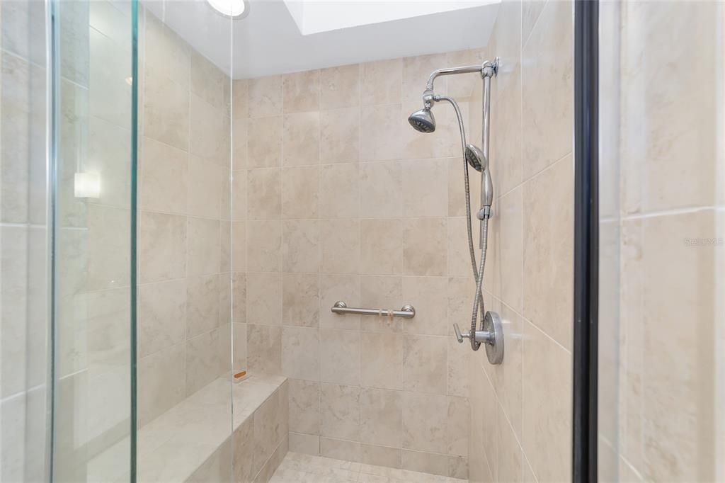 OWNER'S MARBLE GLASS SHOWER WITH BENCH