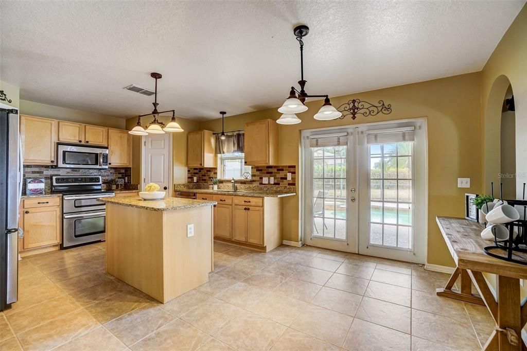 Kitchen with French doors to the lanai & pool