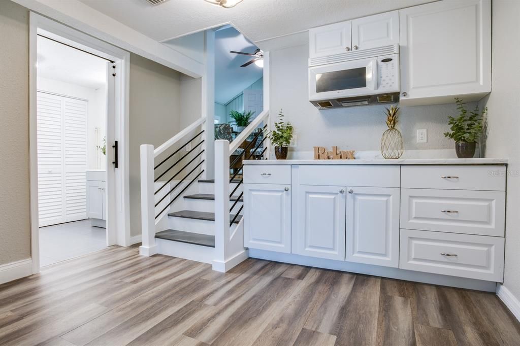 Stairs to lower level with Cabinetry