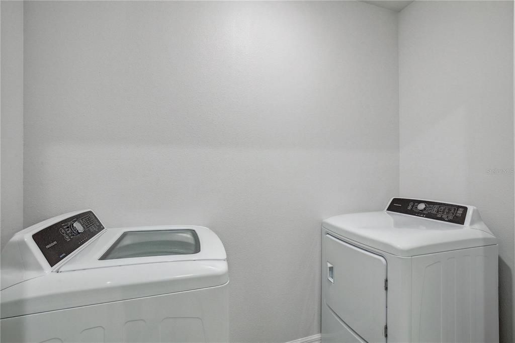 Laundry room with included upgraded washer and dryer
