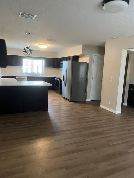 House dining area view into kitchen