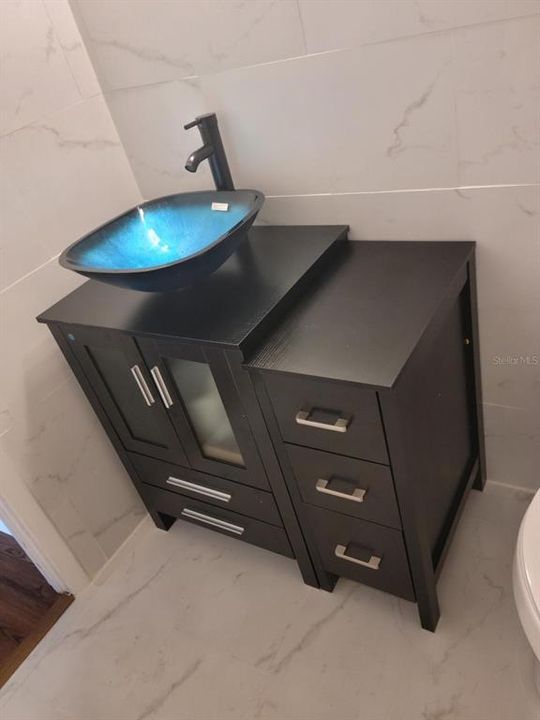 Bath Vanity with Floor to ceiling tile