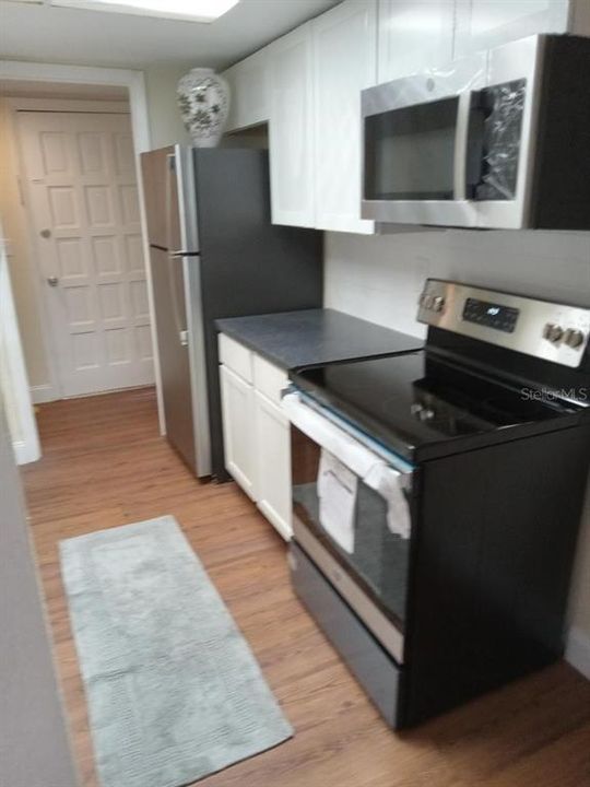 Kitchen with new upper cabinets. Brand New Appliances