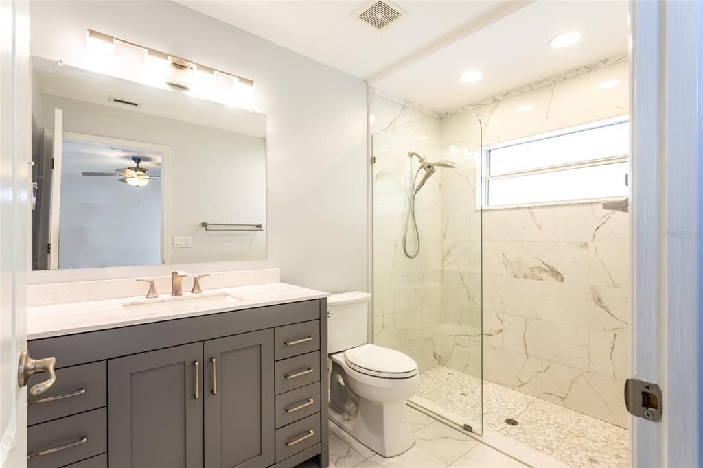 Primary bathroom with updated walk-in shower