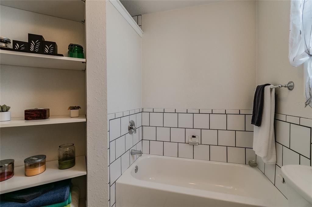 Large bathroom with tub and separate shower