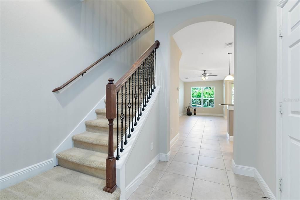 A foyer with an arched entryway leads you to the wonderful open floor plan.